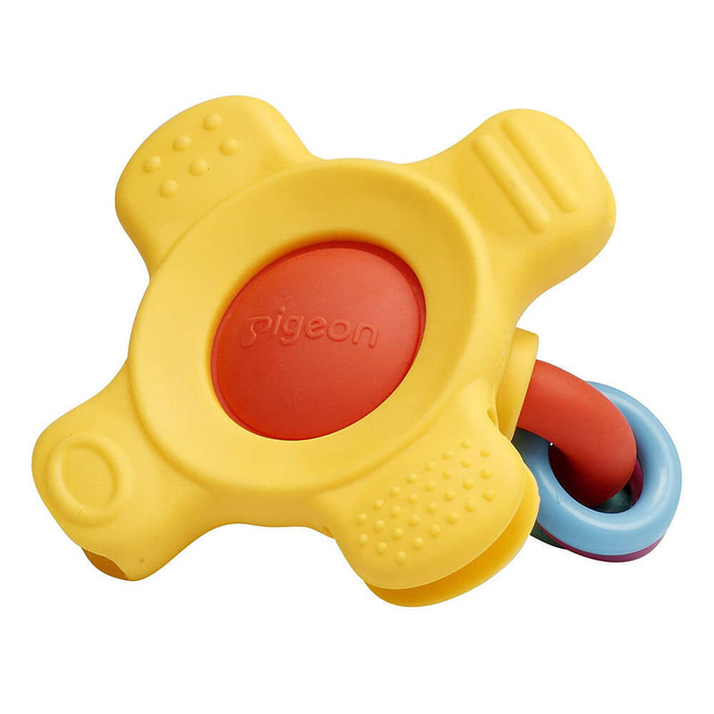 The Pigeon Training Teether Step 2 by Pigeon features a yellow and red cross-shaped design with textured surfaces, a red center, and blue and red linked rings—ideal for soothing baby’s gums and promoting healthy periodontal ligaments.