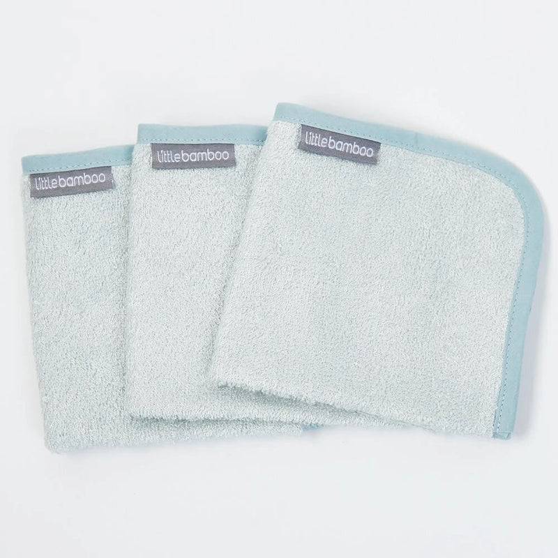 The Little Bamboo Towelling Washers 3 Pack features three soft baby washcloths in light blue with a gray "Little Bamboo" label, each trimmed in slightly darker blue. Gentle on sensitive skin, these are perfect for baby care.