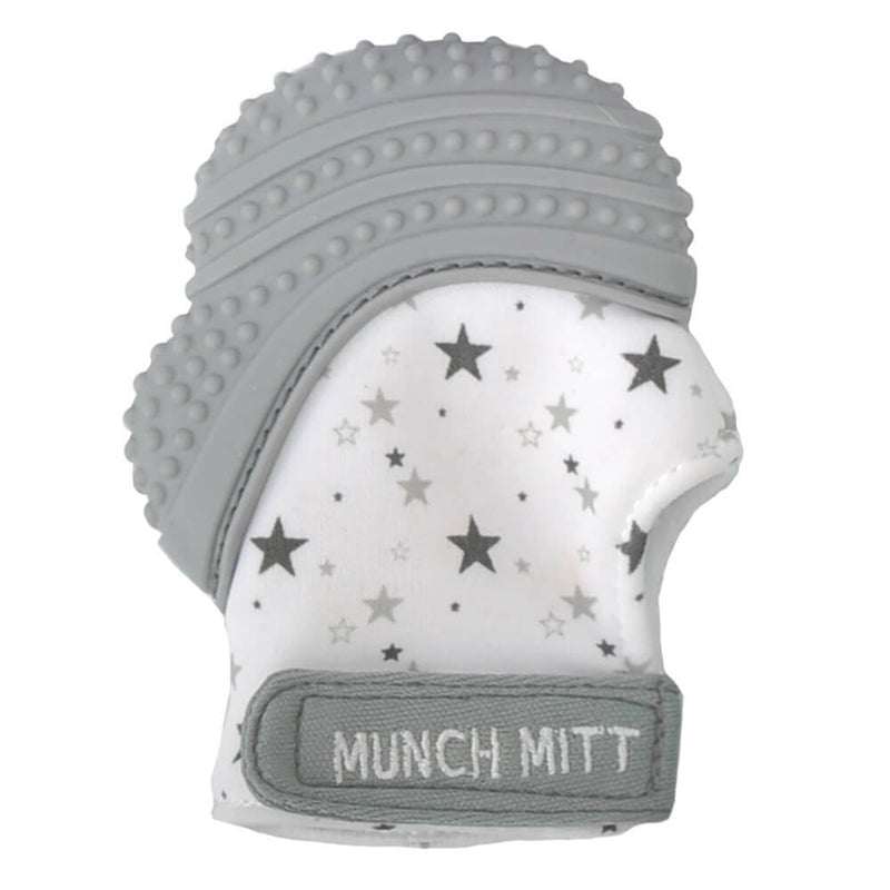 The Munch Mitt Teething Mitten by Munch Mitt features a gray and white silicone top for soothing relief, a fabric base with black star patterns, and offers a handy teether option for babies.