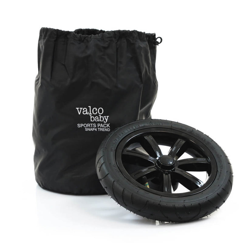 A Valco Baby Trend 4 Sports Wheel Pack featuring black all-terrain air tyres is displayed in front of a branded black drawstring bag on a white background, showcasing the wheels for a smoother ride.