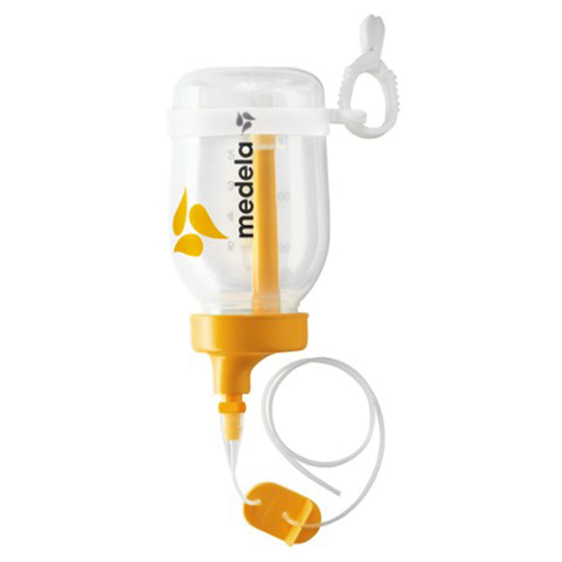 The Medela Supplemental Nursing System 150ml features a yellow lid, attached tubing, clip for milk supplementation, and a clear container with measurement markings and the Medela logo.