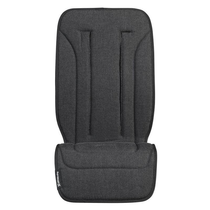 The UPPAbaby Reversible Seat Liner, shown in dark gray with two vertical harness slots and a folded bottom area, is machine washable and displayed against a white background.