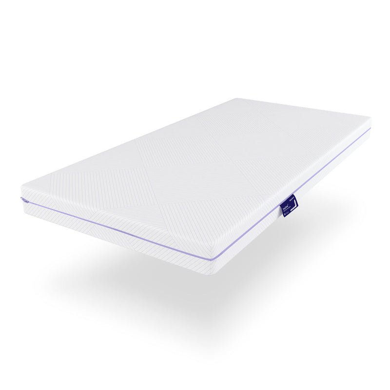 The BabyRest DuoCore Cot Mattress / 132x70 is a white rectangular topper with subtle diagonal lines and a small blue BabyRest tag, featuring dual-sided technology for optimal baby sleep support, shown on a white background.