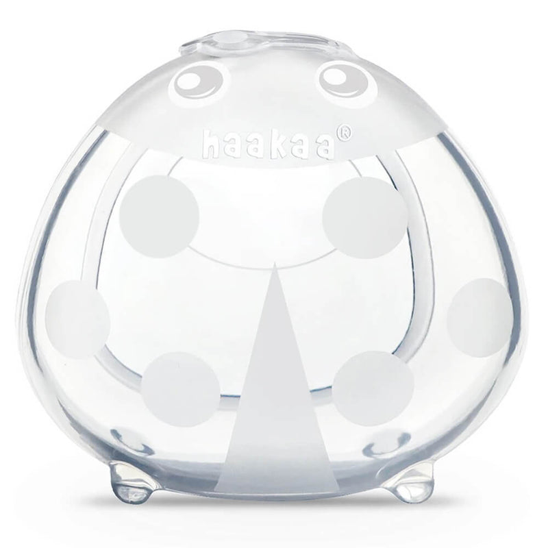 The Haakaa Silicone Milk Collector 75ml features a rounded pouch with polka dots and triangles, a small spout, and stable flat base—making breast milk collection easy and mess-free.