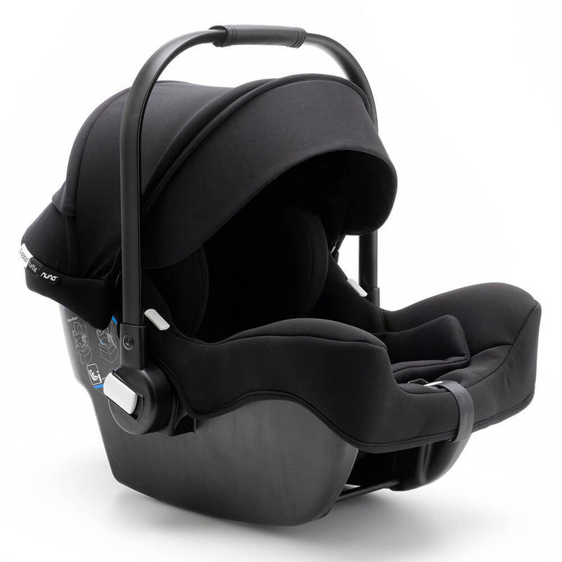 The Bugaboo Turtle by Nuna 2025 is a black infant car seat with a carrying handle, contoured sides, and sun canopy, offering safety and comfort for your baby during car travel.