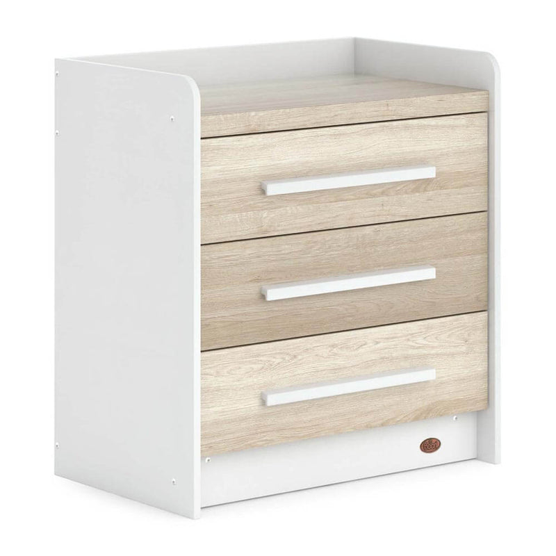 The Boori Neat 3 Drawer Chest by Boori features three light wood drawers with horizontal white handles and a white frame with rounded front edges, offering a modern and stylish storage solution for any room.