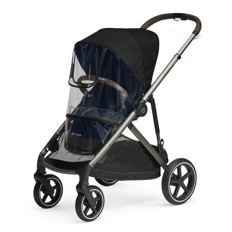 The Cybex Gazelle S stroller, featuring a black canopy, brown handlebar, large wheels, and the Cybex Gazelle S Seat Raincover for weather protection, is displayed on a white background.