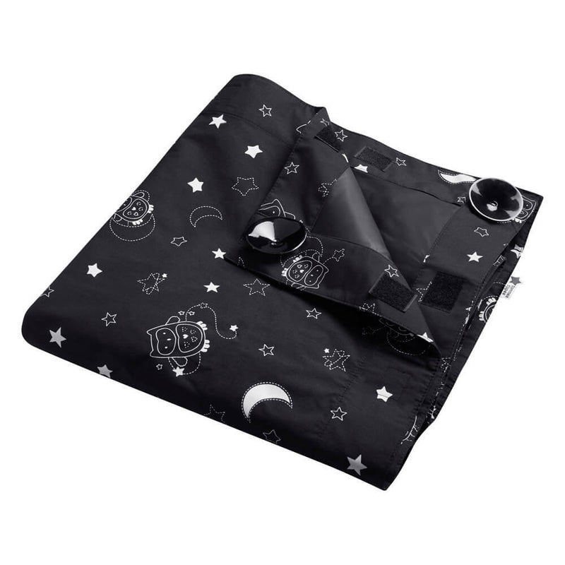 The Tommee Tippee Portable Blockout Blind is a black fabric sleep curtain with white cartoon owls, stars, and moons, plus suction cups in the corners—perfect for creating a nap-friendly blackout space anywhere.