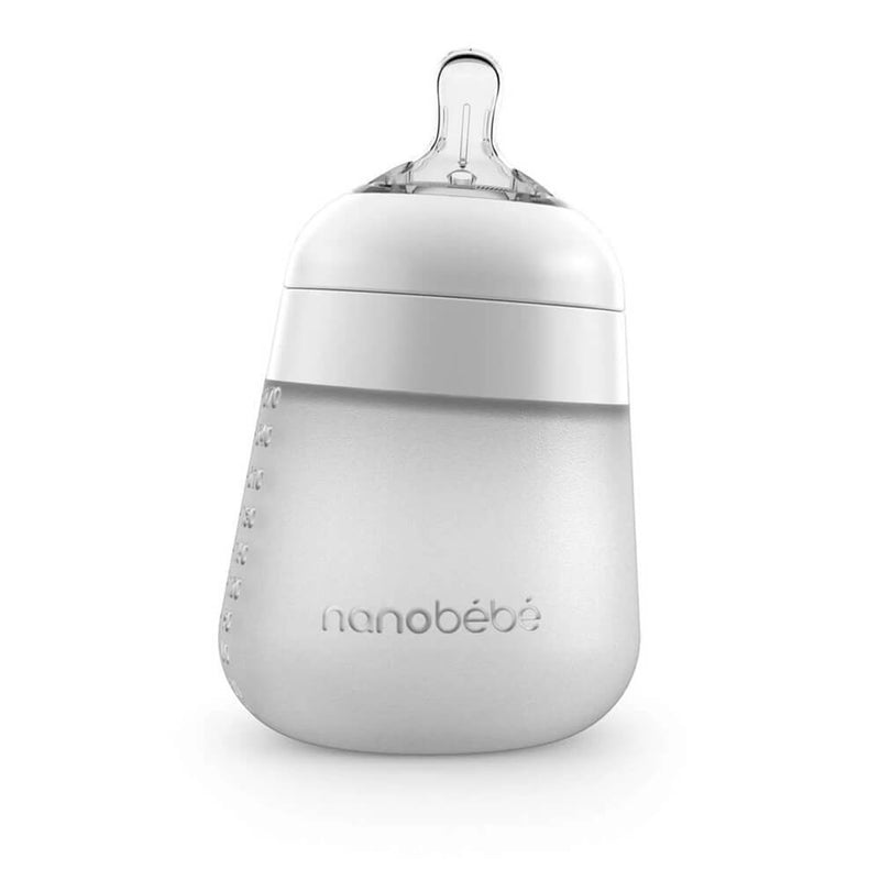 The Nanobebe Flexy Silicone Bottle is a translucent white, wide-base silicone baby bottle with an anti-colic design, clear nipple, and white screw-on lid. "Nanobebe" is printed on the front—an ideal gift for baby showers.