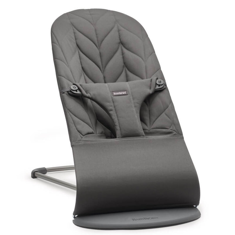The BabyBjorn Bouncer Bliss Woven Petal Quilt features a gray, quilted fabric seat, adjustable harness, ergonomic design, sturdy metal frame, and iconic branded base for gentle rocking.