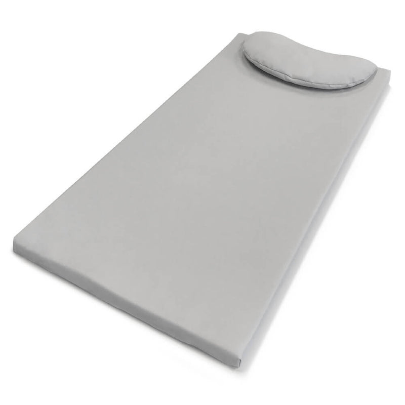 The Boori Soft Lux Change Pad by Boori, in light gray waterproof PU leather, features a matching oval pillow at the top and is displayed on a plain white background.