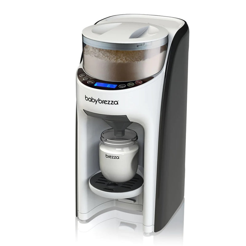 The Baby Brezza Formula Pro Advanced Dispenser in white and black automatically dispenses formula into a bottle on its tray, with a digital display and control buttons visible on the front of this advanced Baby Brezza device.