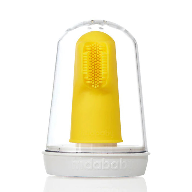 A Frida Baby Finger Toothbrush in yellow silicone, with soft bristles for gentle teething relief, stands upright in a clear plastic case with a white base.