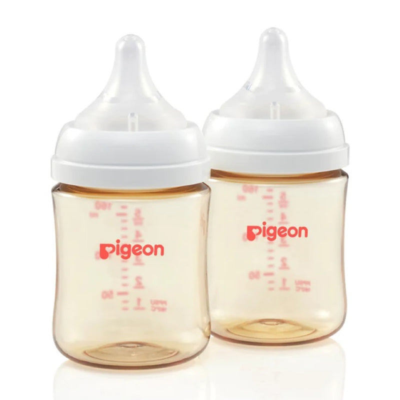 Two transparent Pigeon SofTouch III Bottle PPSU 160ml bottles with white caps, red measurement lines, and "Pigeon" branding stand side by side. This twin pack supports breastfeeding and features a PPSU design for durability and safety.