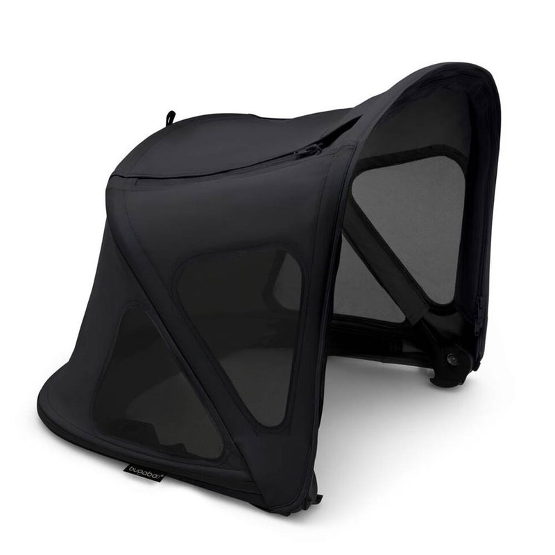 The Bugaboo Fox5/Cub/Kangaroo Breezy Sun Canopy by Bugaboo is a black, mesh-sided stroller sun shade with a curved modern design, UPF 50+ protection, and triangular mesh windows for ventilation. Detached and resting on a flat surface.