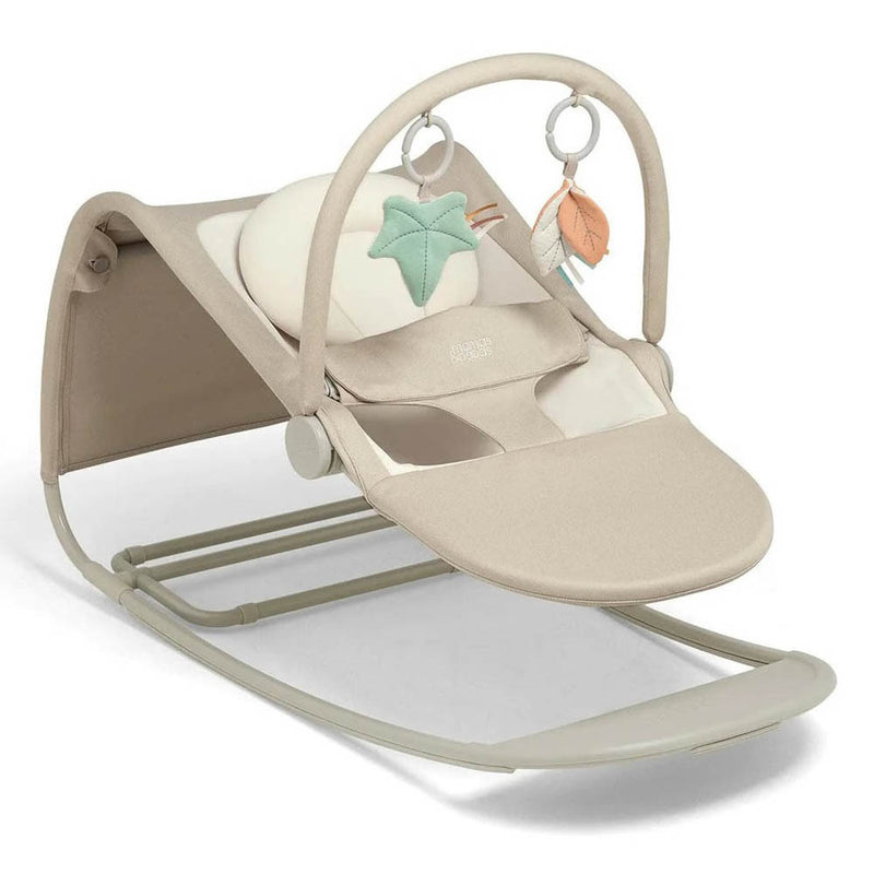 The Mamas & Papas Tempo 3-in-1 Bouncer features a soft beige seat, adjustable recline, padded headrest, and a toy bar with sensory toys—a green star and orange leaf plush—in a minimal, modern design.