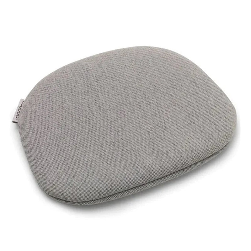 The Bugaboo Giraffe Junior Pillow by Bugaboo is a light gray, square pillow with rounded corners and a fabric texture, designed for the Giraffe chair. It’s machine washable and pictured on a white background.