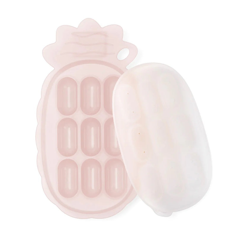 The Haakaa Silicone Pineapple Nibble Tray is a pale pink, pineapple-shaped tray with a lid and eight oval compartments—ideal for freezing baby food or serving snacks.