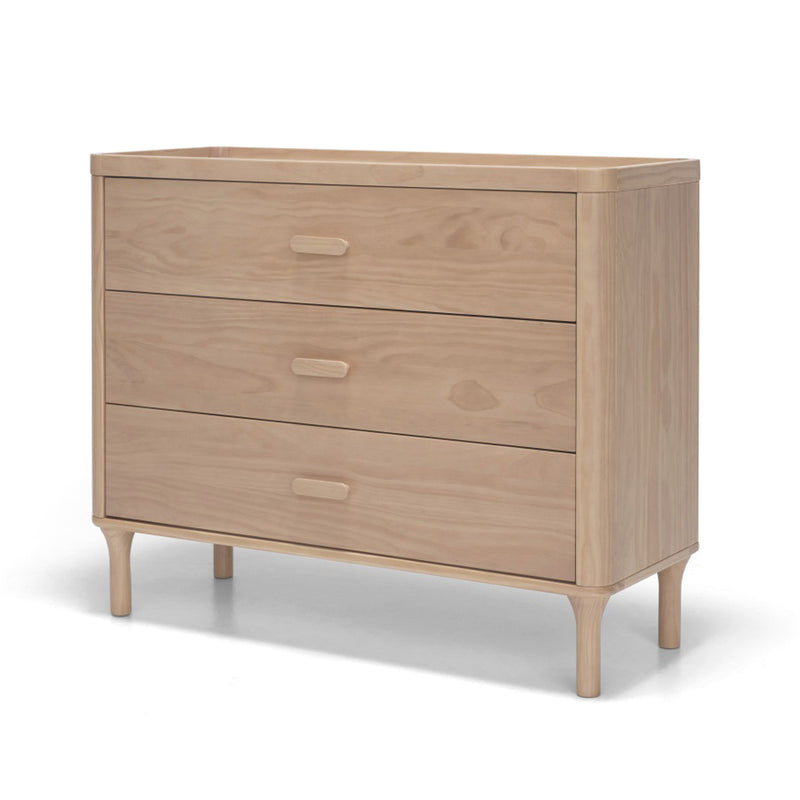 The Seena Willow 3 Drawer Chest by Seena features light wood, rectangular handles, rounded edges, and stands on short tapered legs. Crafted from sustainably sourced materials, it's part of the Willow Collection.