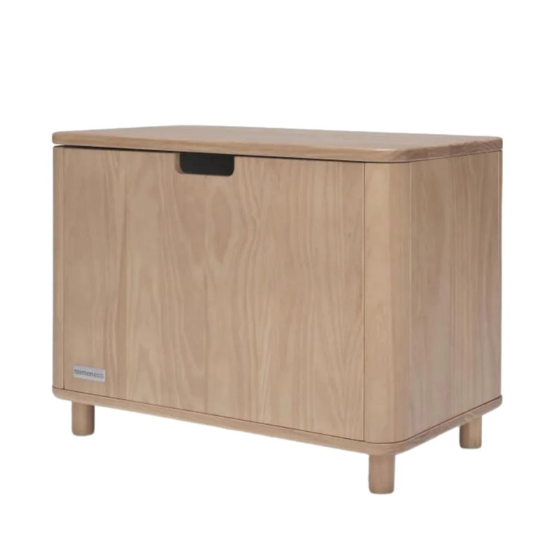 The Seena Willow Toy Box by Seena is a rectangular pine storage chest with rounded edges, a front cut-out handle, and four short legs. Its sustainable design features a light natural finish that highlights the wood's beauty.