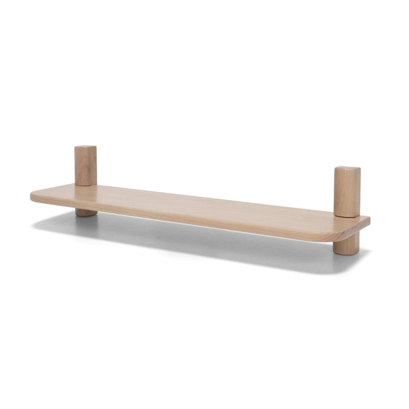 The Seena Willow Single Shelf by Seena is a minimalist pine shelf with rounded edges and two cylindrical supports at each end, ideal for contemporary interiors and displayed against a white background.