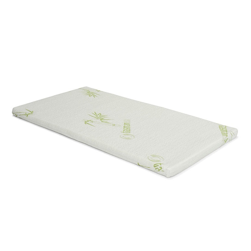 The Seena Bassinet Mattress by Seena is a rectangular, white topper with a bamboo leaf pattern and green text, shown on a white background. Soft and slightly thick, it adds comfort while meeting Australian Cot Mattress Standards.
