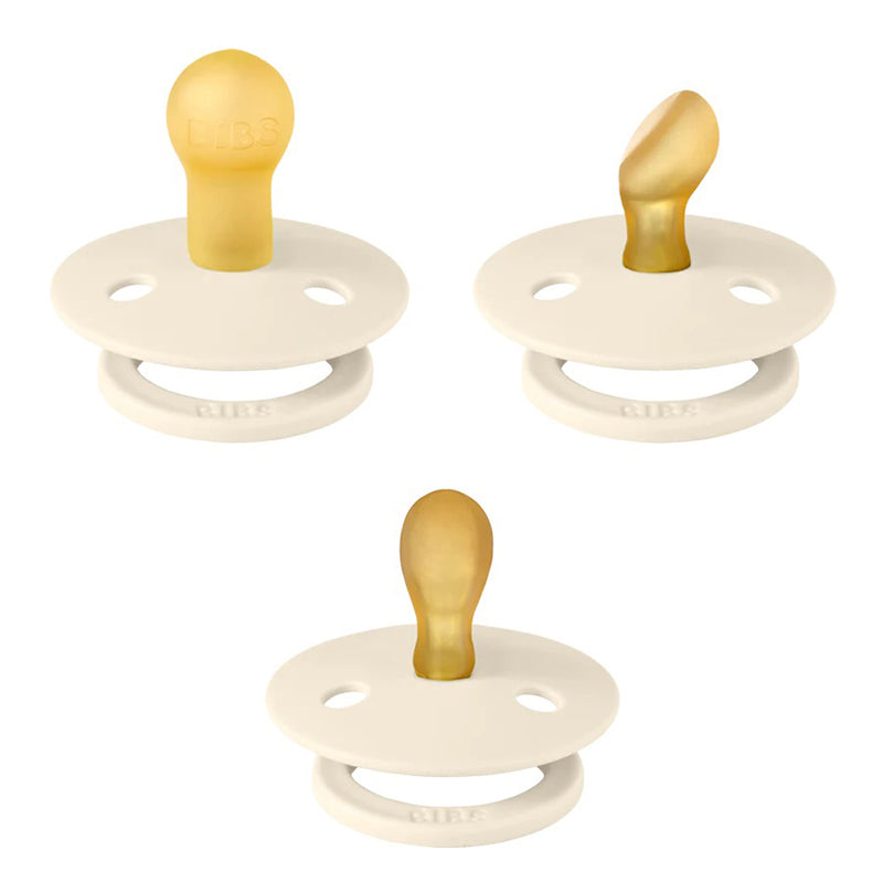 The BIBS Try It Colour 3pk by Bibs Dummies features three ivory pacifiers with round bases, natural rubber latex nipples, two vent holes, and the “BIBS” logo embossed on each base; shown from multiple angles.