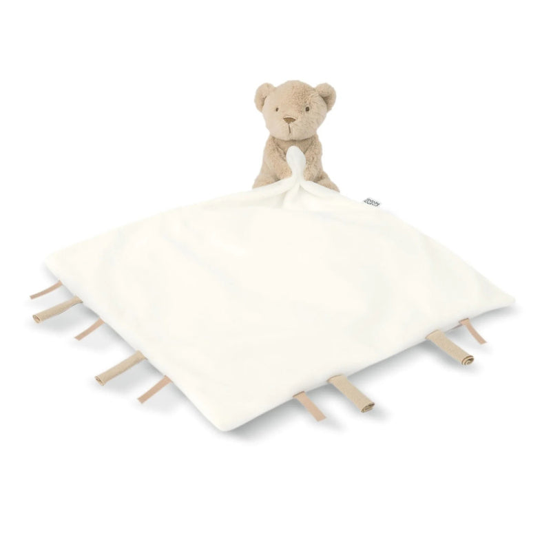 The Mamas & Papas Bear Comforter features a soft beige bear plush toy attached to a white security blanket with beige ribbon tags on the edges, shown against a white background.