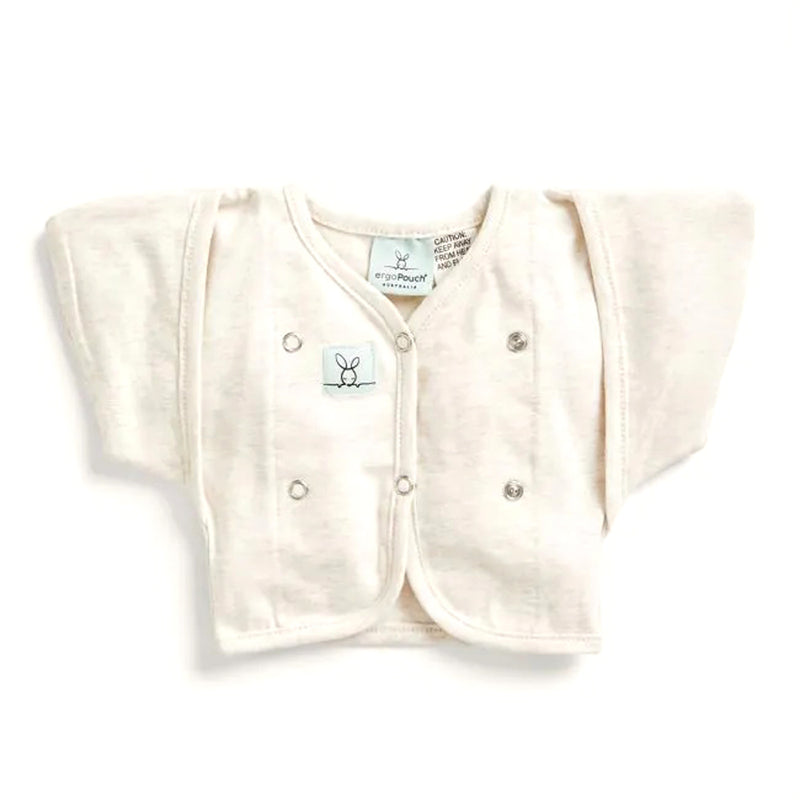 The ErgoPouch Butterfly Cardi by ErgoPouch is a cream-colored, long-sleeve baby cardigan with snap buttons and a bunny logo—ideal for arms-out sleeping as your baby transitions from swaddle, made from soft, comfortable material.