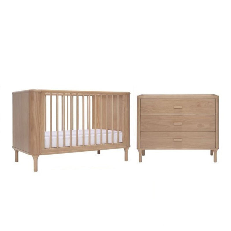 The Seena Willow Cot + Mattress + Dresser set by Seena features a natural wood baby cot, white pocket spring mattress, and matching three-drawer dresser, displayed side by side on a plain white background.