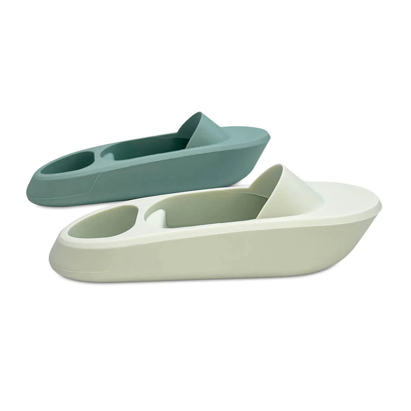 Two Cherub Baby Silicone Bath Toy Boats in Oyster and Sage, each with a modern contoured design and built-in handle, are shown on a white background.