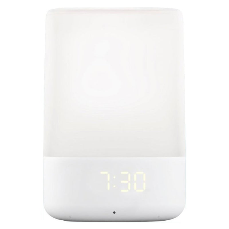 The Nanit Sound & Light Machine by Nanit is a modern white digital clock featuring a soft glowing night light on top and an LED display showing the time at 7:30.