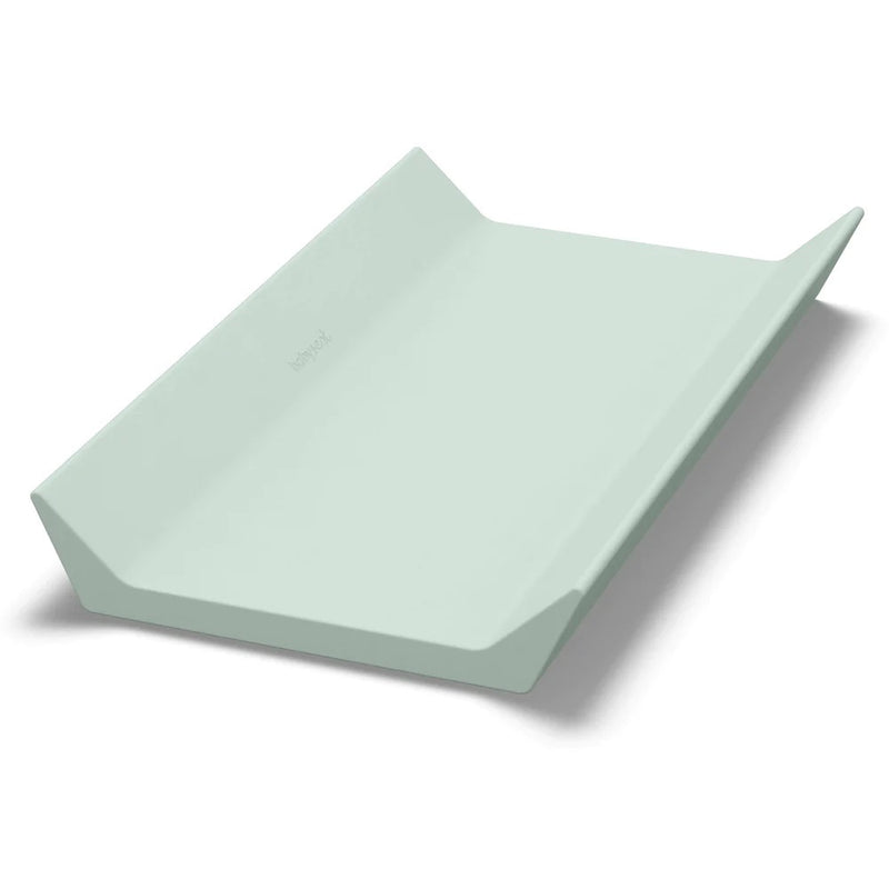 The BabyRest Nova Changer Top Sage by BabyRest is a pale green, contoured changing mat with raised sides and a smooth surface, designed for safe and comfortable diaper changes.