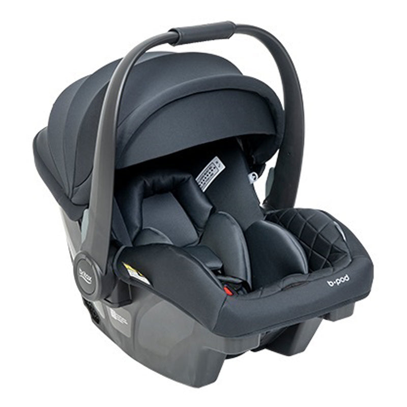The Britax Safe-n-Sound B-Pod Low Birth Weight Capsule is a black baby capsule with carrying handle, padded interior, adjustable canopy, and ClickTight installation for secure, easy use as a newborn car seat designed for safety and comfort.