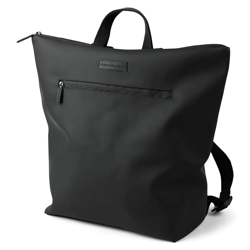 The Done By Deer Changing Backpack Black by Done By Deer is a minimalist, weatherproof diaper bag featuring a top handle, front zip pocket, and adjustable shoulder straps, shown against a white background.