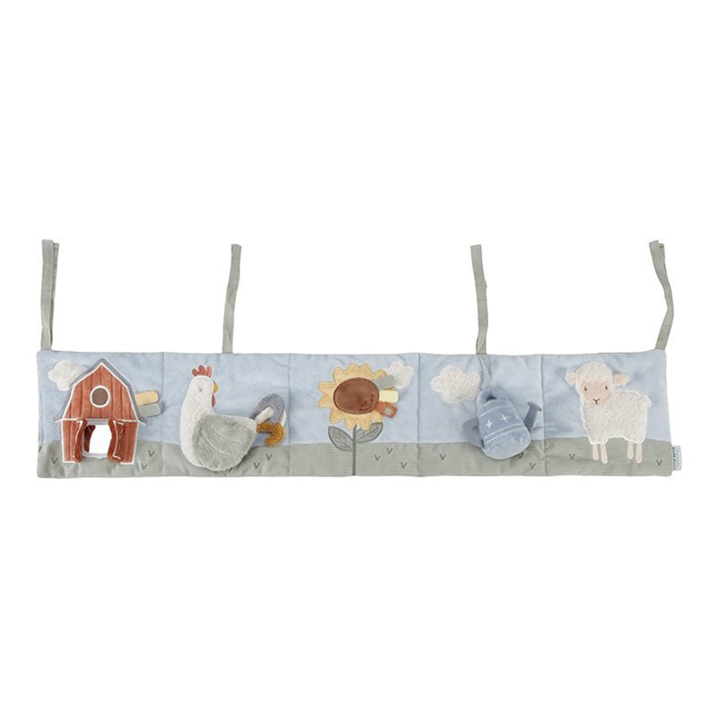 The Little Dutch Little Farm Playpen Activity Book is a soft, rectangular activity hanger with farm-themed appliqués. With three top straps, it attaches easily and helps develop your baby's hand-eye coordination.