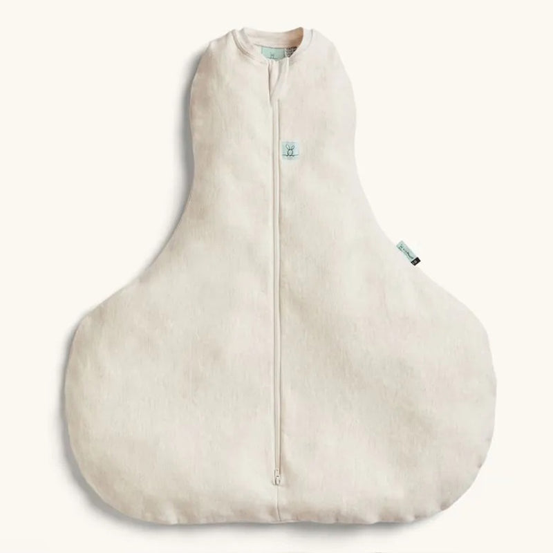 The ErgoPouch Hip Harness 1.0 Tog Cocoon in Oatmeal Marle, by ErgoPouch, is a beige swaddle sleep sack with a front zipper, wide bottom for hip dysplasia, and side tag, shown laid flat on a light background.