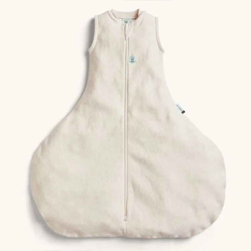 The ErgoPouch Hip Harness 1.0 Tog Sleeping Bag in Oatmeal Marle, a sleeveless beige sleep bag with wide rounded bottom and front zipper for comfort and support, is shown on a plain light background.