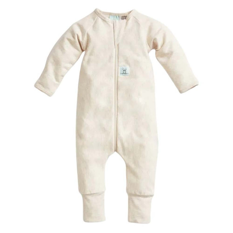 The ErgoPouch 1.0 Tog Layers Onesie in Oatmeal Marle, a cream-colored long-sleeve baby sleepsuit with a front zipper, closed feet, and chest logo patch from ErgoPouch, is laid flat on a white background.
