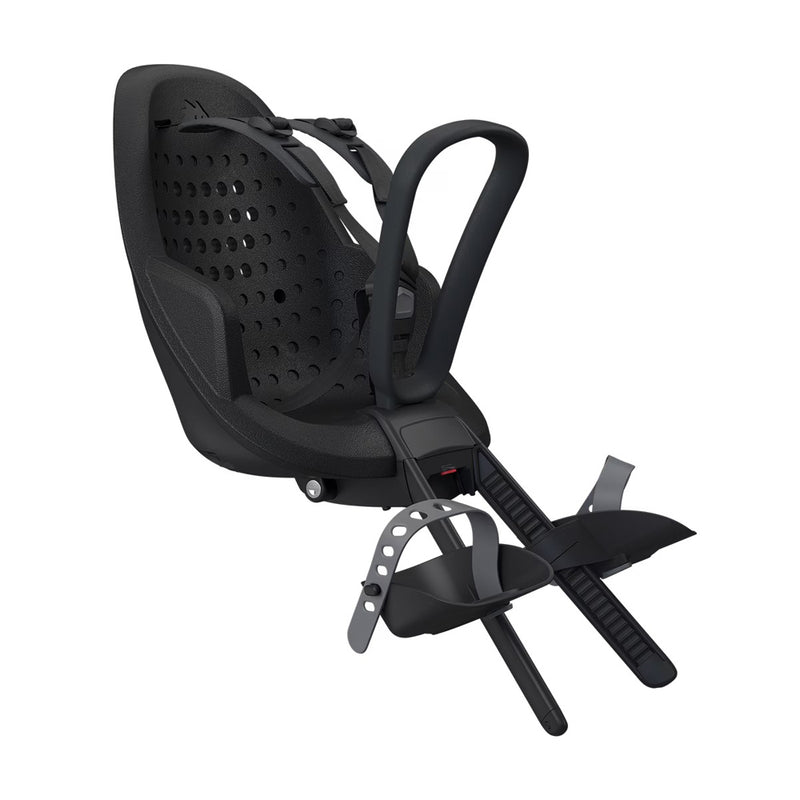 The Thule Yepp 2 Mini Black by Thule is a front-mounted child bike seat featuring a shock-absorbing foam seat, ventilation holes, adjustable safety harness, footrests with adjustable straps, and a curved front handlebar attachment.