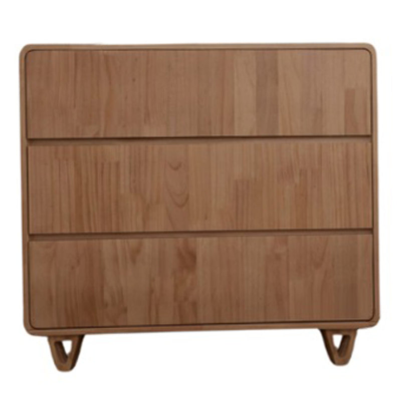 The Cocoon Vibe 3 Draw Dresser Sandstone by Cocoon features a smooth, minimalist design with curved edges, three wooden drawers, and stands on short, angled legs—ideal for any nursery.