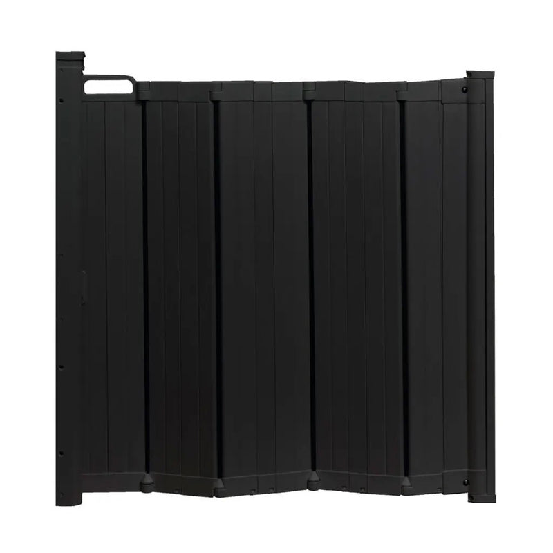 The BabyDan Babydan Guard Me Black is a foldable, black privacy fence panel with a top-left handle and vertical slats, standing upright in an accordion-style baby-proof design, resembling a retractable safety gate.