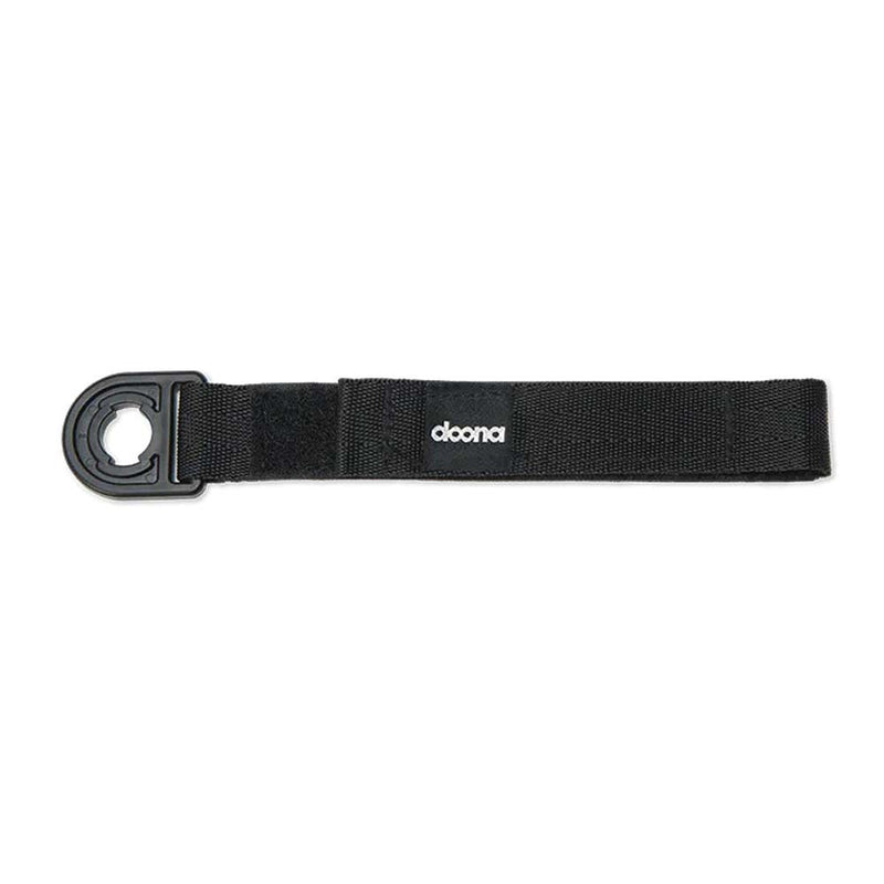 The Doona Liki Pedal Strap by Doona features a black design with a plastic hook and fabric loop, ideal as a trike accessory or for securing items to strollers or car seats.