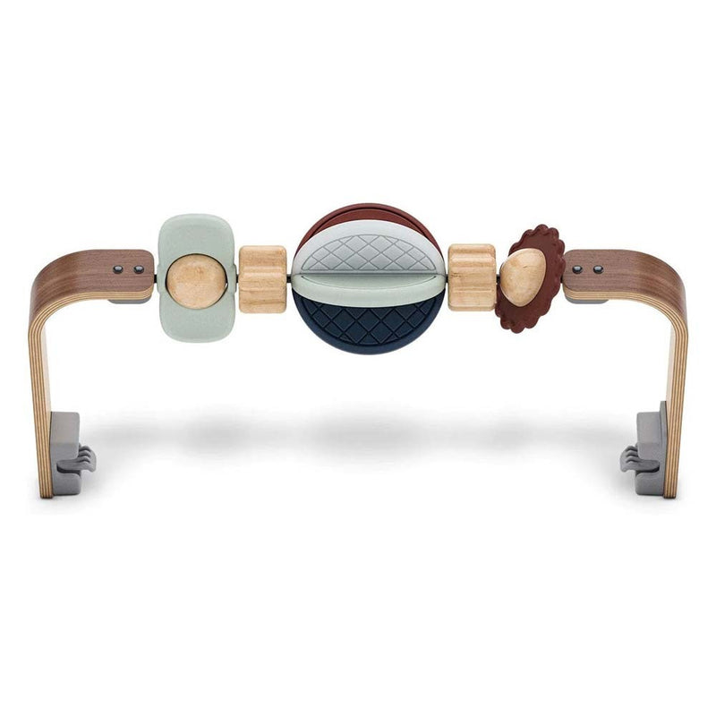The UPPAbaby Mira Toy Bar by UPPAbaby is a wooden baby activity gym with curved legs and colorful, textured shapes and beads to encourage infants’ hand-eye coordination and fine motor skills as they play.
