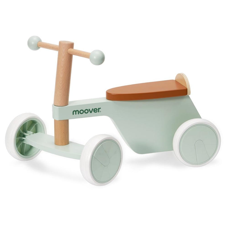 The Moover Toys Essentials Ride On Bike Green by Moover features a light green wooden frame, four rubber-lined wheels, a tan seat, and wooden handlebar—perfect as a toddler’s first bike. "Moover" is printed on the side.
