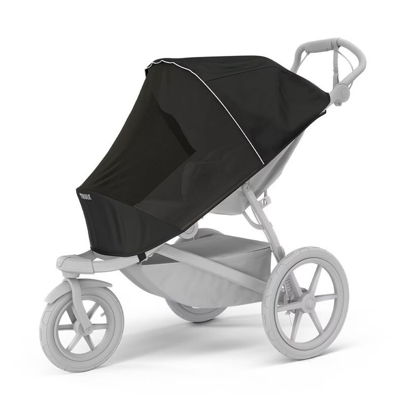 The Thule Urban Glide 3 Single Mesh Cover by Thule is a grayscale jogging stroller with three large wheels, a black mesh insect cover, and an under-seat storage basket.