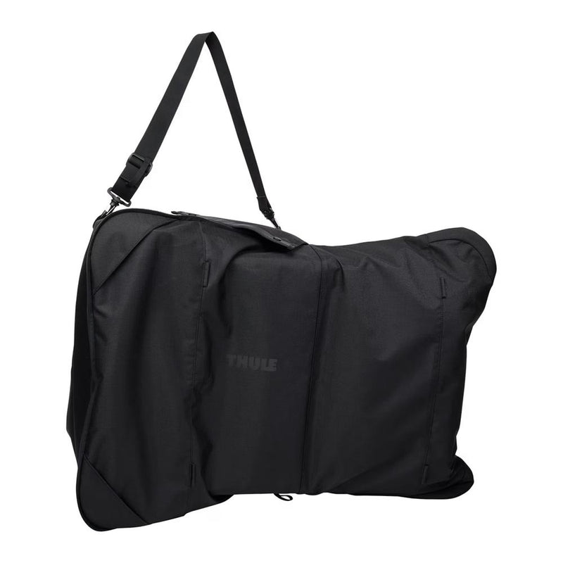 The Thule Stroller Travel Bag Large by Thule is a spacious black bag with a shoulder strap, perfect for safely carrying your foldable stroller, gear, or equipment during travel.