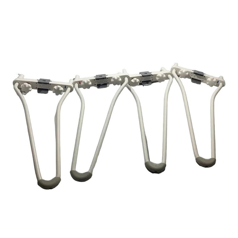 The Happiest Baby Snoo Low Legs are four white, hinged legs with slip-resistant features, designed to fold for space-saving storage and efficient organization.