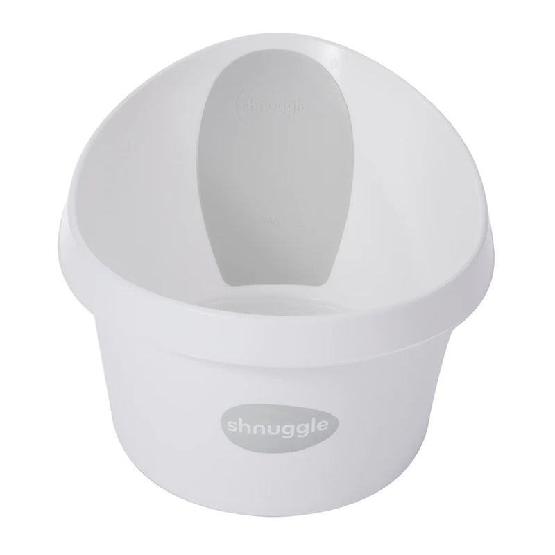 The Shnuggle Toddler Bath Tub in white/grey features a rounded shape and built-in gray backrest for infant support. The "Shnuggle" brand name is printed on the front of this baby bath.