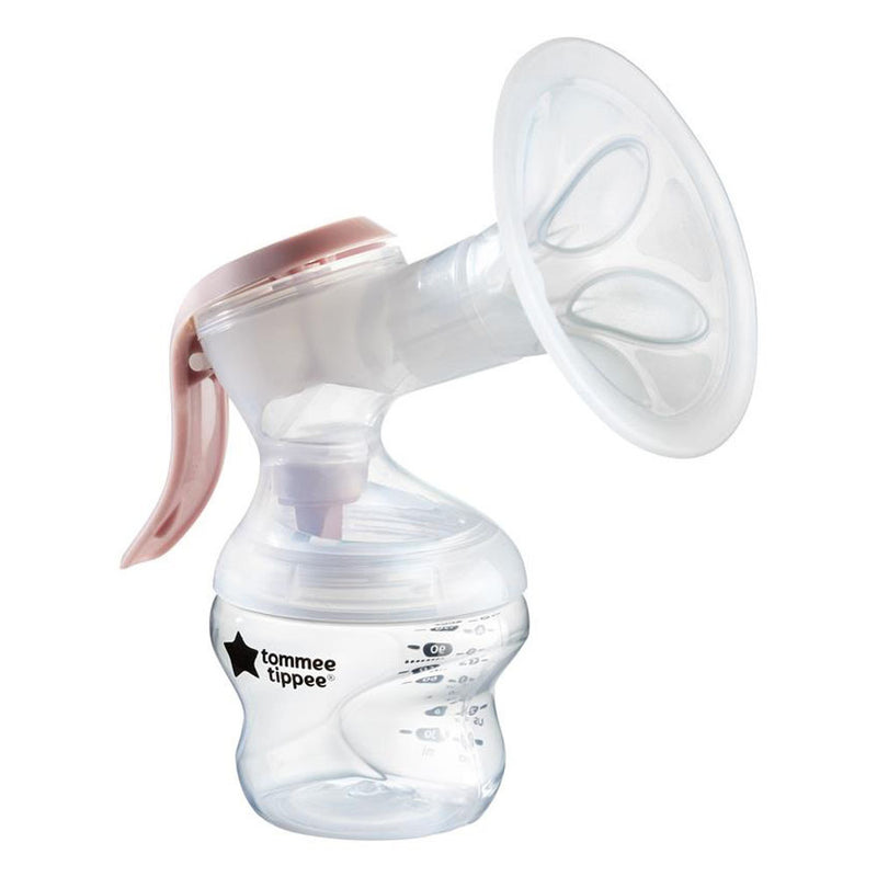 The Tommee Tippee Made For Me Single Manual Breast Pump features a transparent design with a white silicone flange, clear bottle, and light pink handle for comfortable breastfeeding and efficient milk collection.